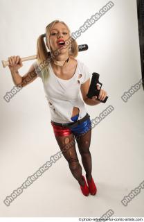 NIKOL WITH BASEBALL BAT AND GUN